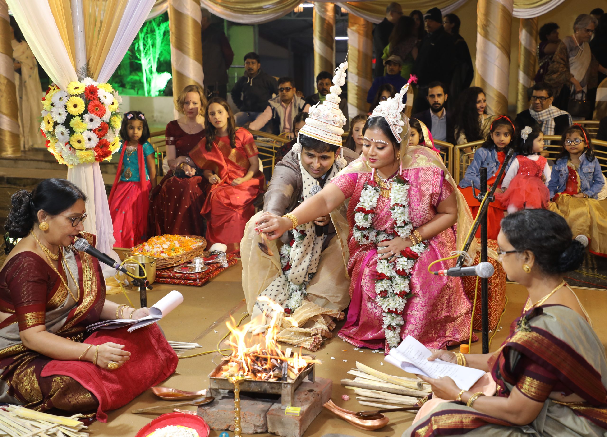 Sharmistha Chaudhuri (center, wearing pink), 35, at her wedding in Kolkata, India in early 2020. Chaudhuri found some Indian wedding traditions retrograde, so she hired four feminist priestesses to officiate hers. They performed a multi-lingual, egalitarian ceremony stripped of patriarchy.

Sharmistha Chaudhuri